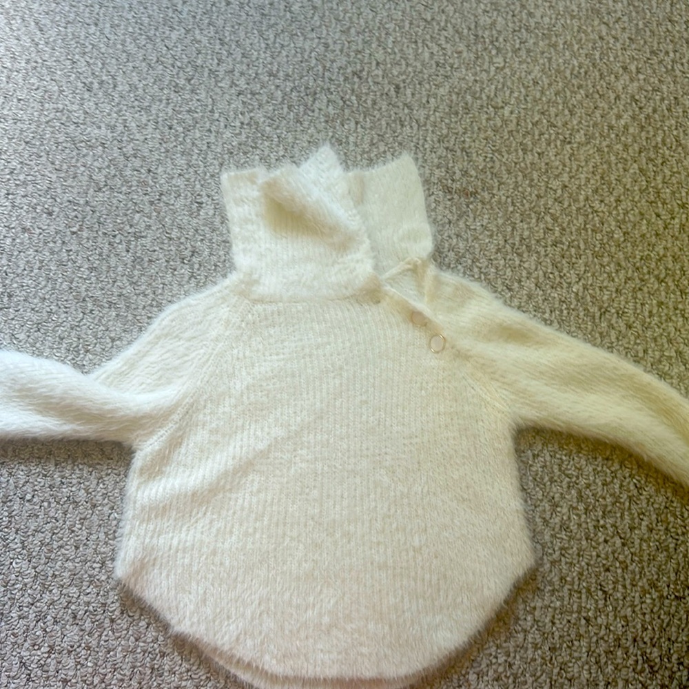 white fuzzy sweater